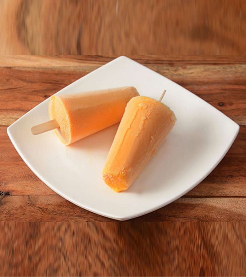 kesar-kulfi-served-white-plate-rustic-wooden-background-selective-focus